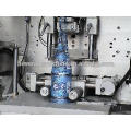 High speed bottle labeler/sleeve applicator